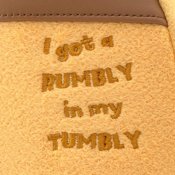 Embroidered quote ‘I got a rumbly in my tumbly’ on Loungefly Pooh Hunny Tummy backpack plush fabric


