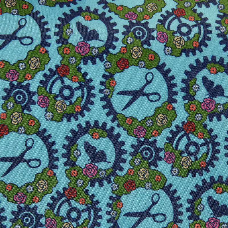 Close-up pattern featuring gears, scissors, butterflies and flowers from the Loungefly Edward Scissorhands crossbody bag lining.