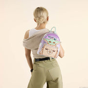 Loungefly Grogu mini backpack worn on the back, showing pastel purple sky, butterflies and braided top handle