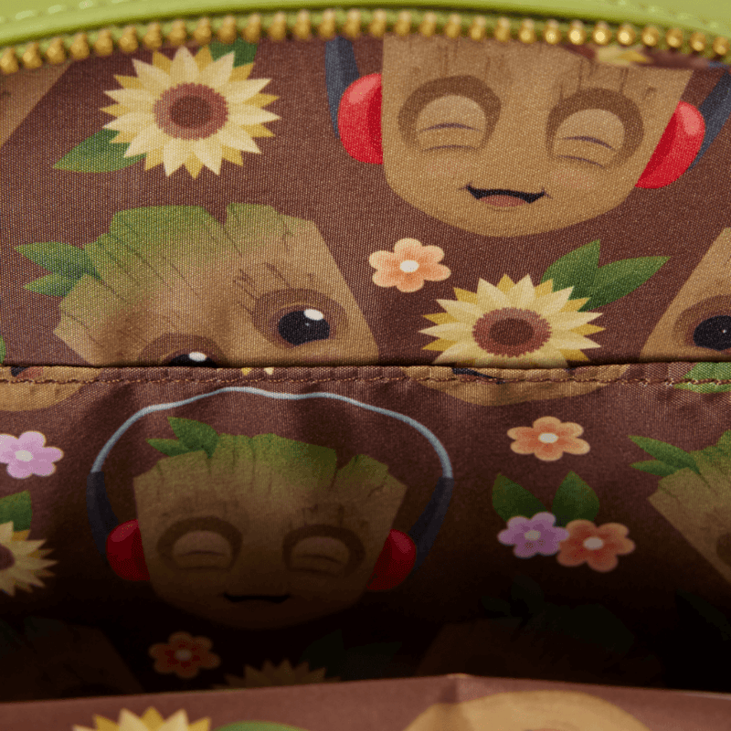 Interior lining of Loungefly Groot Spring Blooms Crossbody Bag with Groot character illustrations, headphones, sunflowers and colourful flowers