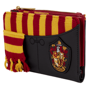 Angled view of Harry Potter Gryffindor Loungefly Wallet showing miniature red and gold scarf, lion crest embroidery and zip
