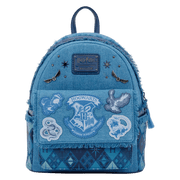 Front view of Loungefly Harry Potter denim mini backpack with Hogwarts crest pocket, house patches and studs.