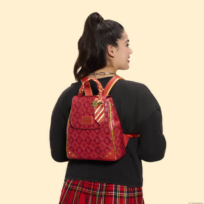 Model wearing Loungefly Harry Potter Gryffindor mini backpack red tartan outfit