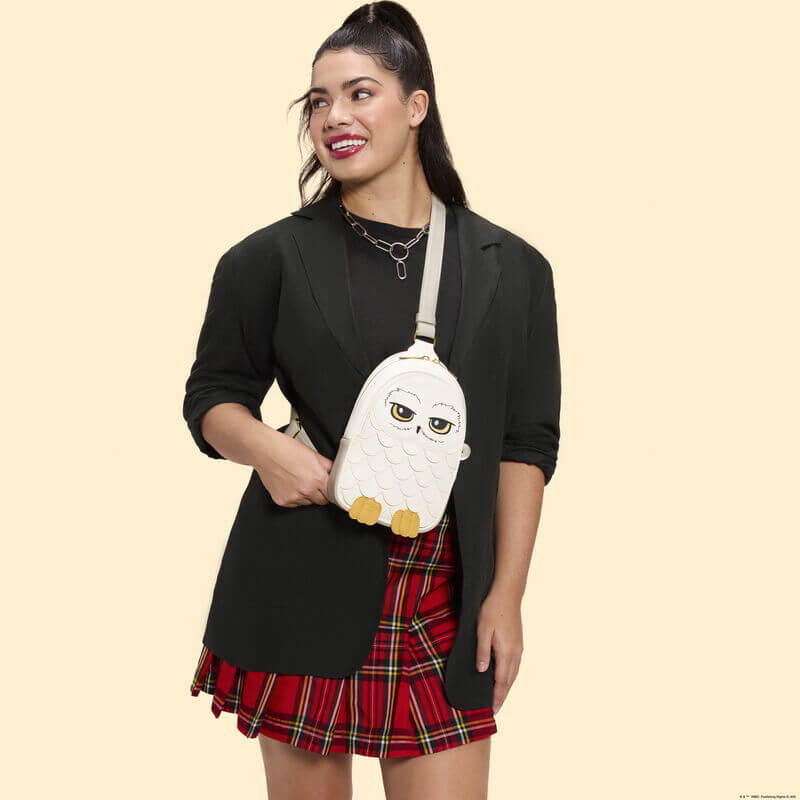 Model wearing Loungefly Harry Potter Hedwig crossbody bag owl design