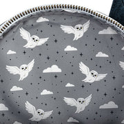 Grey interior lining of Loungefly Hogwarts Castle mini backpack featuring flying Hedwig owl print

