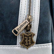 Close-up of antique gold Loungefly zip pull with Hogwarts crest on Hogwarts Castle mini backpack
