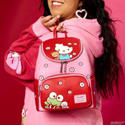 Model wearing pink Loungefly Hello Kitty colourblock mini backpack; front flap shows Hello Kitty and blossom motifs – Loungefly backpack

