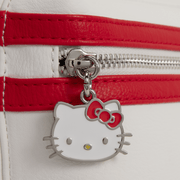 Close-up of Hello Kitty metal zip charm on the red and white Loungefly Cosplay Mini Backpack front pocket