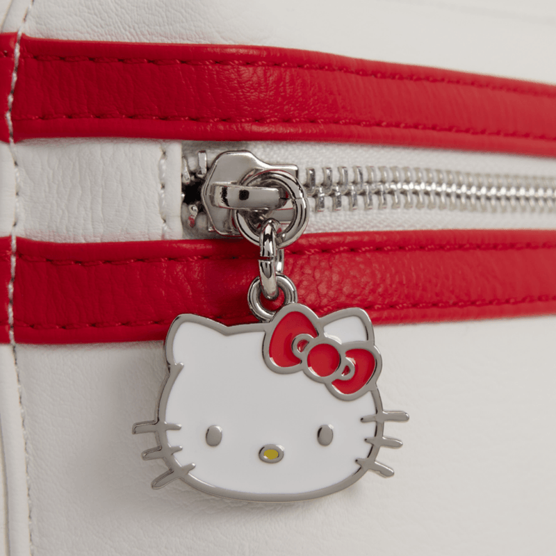Close-up of Hello Kitty metal zip charm on the red and white Loungefly Cosplay Mini Backpack front pocket