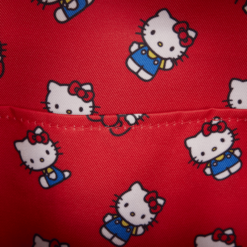 Red interior lining of Loungefly Hello Kitty Mini Backpack with repeating Sanrio Hello Kitty character illustrations