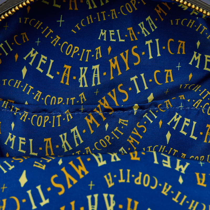 Spell-themed interior lining reading Mel-a-ka-mys-ti-ca inside the Loungefly Hocus Pocus mini backpack