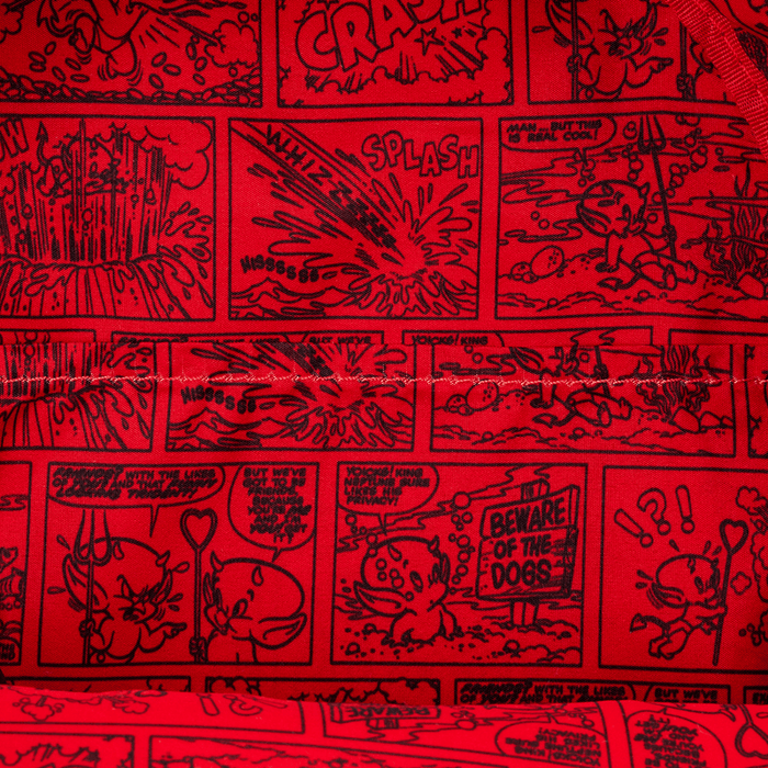 Close-up of red comic-strip lining inside the Loungefly Hot Stuff mini backpack.