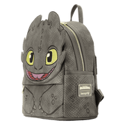 Side view of Loungefly Toothless mini backpack showing scaly texture, zip closure and brand patch