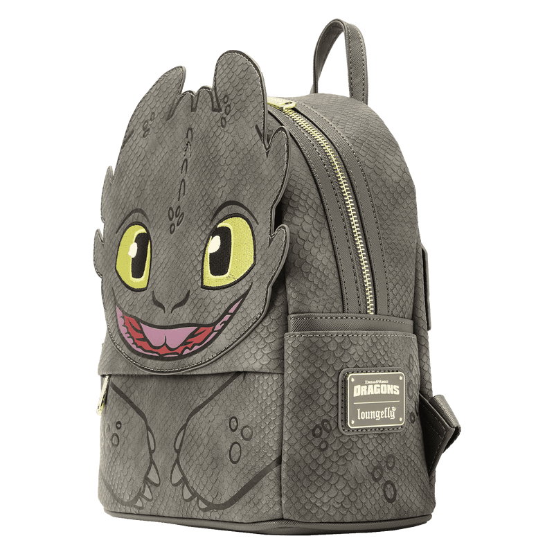 Side view of Loungefly Toothless mini backpack showing scaly texture, zip closure and brand patch