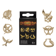 Loungefly Hunger Games mystery pin box surrounded by six possible gold-tone Mockingjay enamel pin designs
