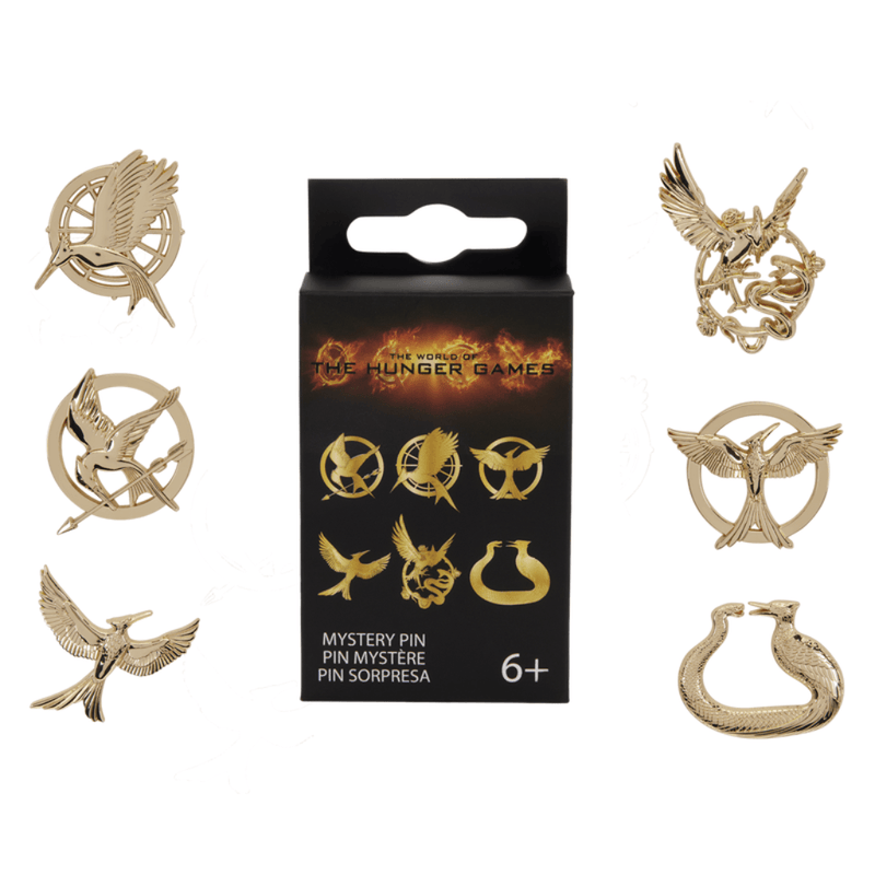 Loungefly Hunger Games mystery pin box surrounded by six possible gold-tone Mockingjay enamel pin designs
