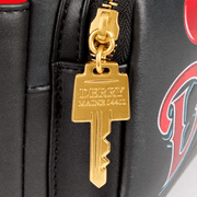 Close-up of gold Derry key zip pull on the Loungefly IT Pennywise mini backpack.