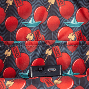 Interior lining with red balloons, Derry keys and paper boat inside the Loungefly IT Pennywise backpack.