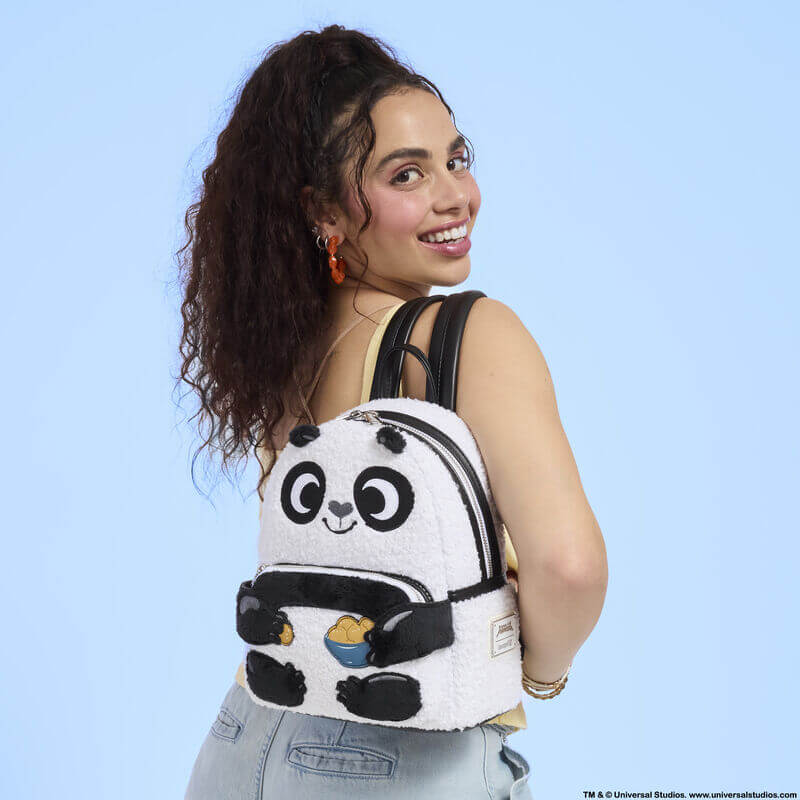Model wearing Loungefly Kung Fu Panda mini backpack over shoulder; sherpa panda face pops – Loungefly backpack lifestyle

