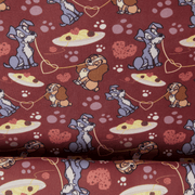 Loungefly Lady and the Tramp interior lining featuring Tramp, Lady, spaghetti, hearts and paw prints on burgundy fabric