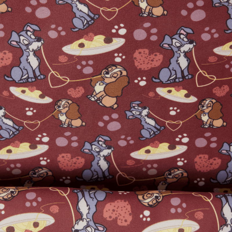 Loungefly Lady and the Tramp interior lining featuring Tramp, Lady, spaghetti, hearts and paw prints on burgundy fabric