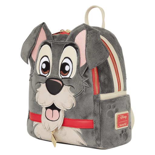 Side view of Loungefly Tramp Plush Mini Backpack showing embroidered face, floppy ears, paw-print detailing and gold-tone zips