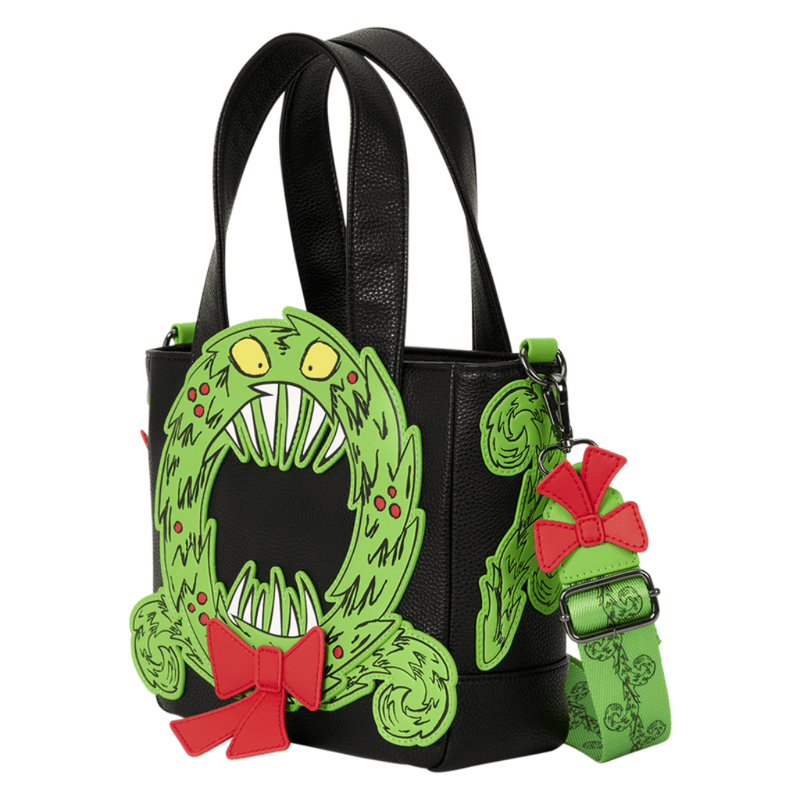 Angled view of Loungefly Nightmare Before Christmas mini tote showing green Man-Eating Wreath appliqué and patterned shoulder strap