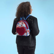 Model wearing Loungefly Spider-Man mini backpack on back, showing patchwork and heart pocket.