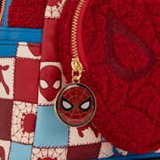 Close-up of Spider-Man face zip charm and textured heart pocket on Loungefly mini backpack.