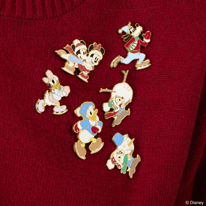 Loungefly Disney Christmas enamel pins featuring Mickey Minnie Donald Daisy Goofy Chip and Dale on red knitwear