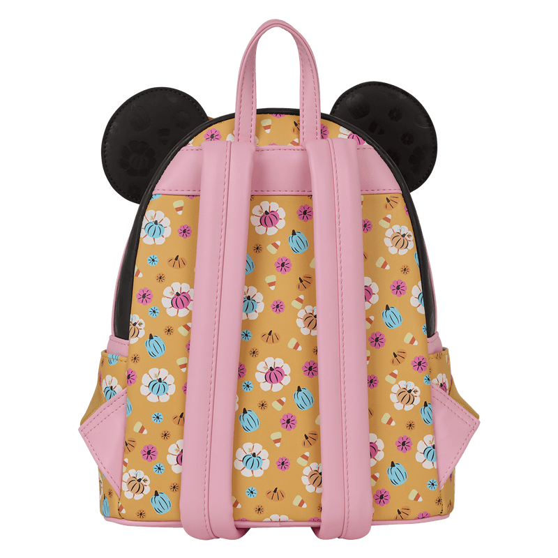 Back of Loungefly Minnie Mouse Halloween mini backpack with pink straps and all-over candy and pumpkin print