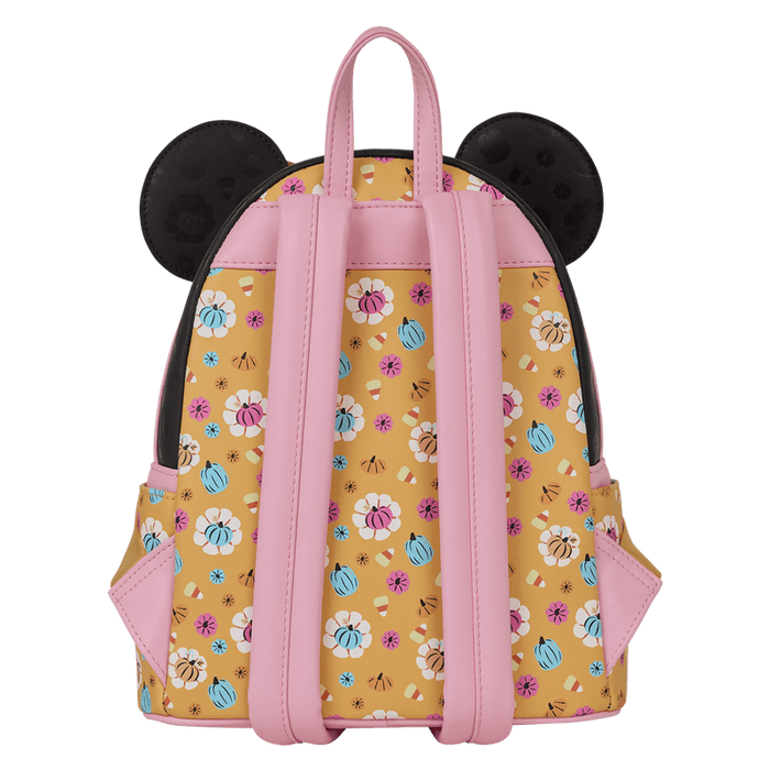 Back of Loungefly Minnie Mouse Halloween mini backpack with pink straps and all-over candy and pumpkin print