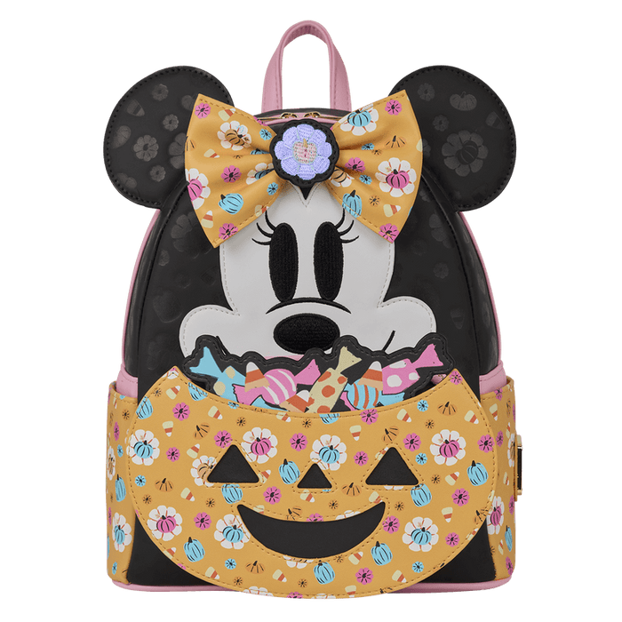 Straight-on front shot of Loungefly Disney Minnie Mouse Halloween mini backpack showing bow detail and candy-filled pumpkin pocket