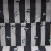 Monster High Frankie Stein Loungefly backpack interior lining with black stripes skulls and lightning bolts