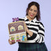 Model holding Loungefly Monsters University scare house mini backpack