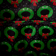 Nightmare Before Christmas Loungefly backpack interior lining with green Christmas wreaths, angry eyes and red bows