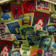 Colourful zombie poster interior lining inside the ParaNorman Loungefly backpack