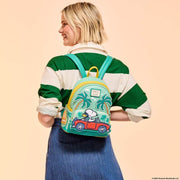 Model wearing Loungefly Peanuts Snoopy Road Trip mini backpack; tropical teal tones and red car appliqué – Loungefly bag

