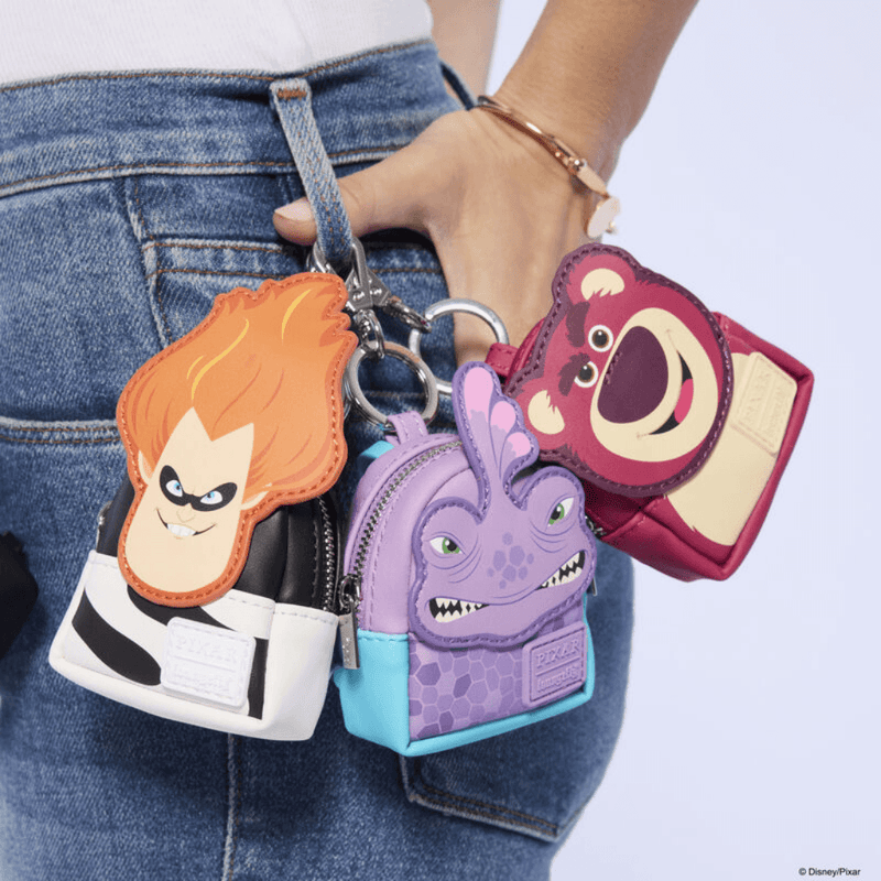 Loungefly Pixar Rivals mystery mini backpack charms attached to jeans