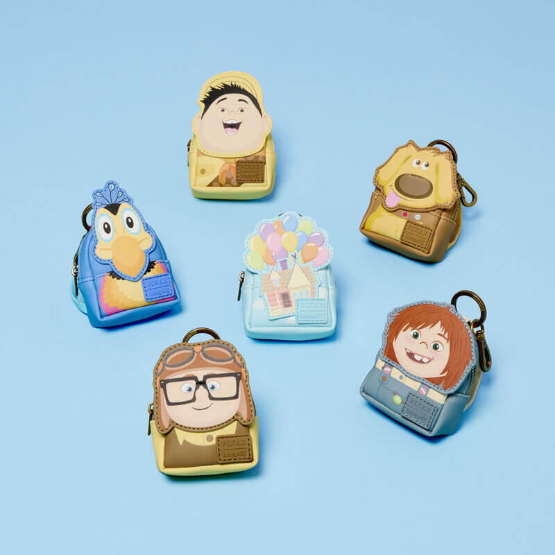 Loungefly Pixar Up mystery mini backpack keychain charms displayed together on a blue background