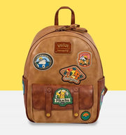 Front view of Loungefly Pokémon Camper Patches backpack with Pikachu, Charmander, and Snorlax embroidered-style badges