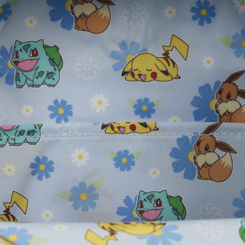 Close-up of the Loungefly Pokémon Floral Mini Backpack lining with Pikachu, Eevee and Bulbasaur among blue and white flowers
