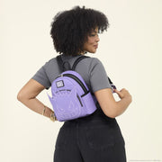 Model wearing Loungefly Pokémon Gengar purple mini backpack to show size and fit – lifestyle photo

