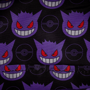 Close-up of interior lining on Loungefly Gengar bag featuring repeating purple Gengar heads and Poké Ball icons on black
