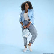 Model holding the Loungefly Pokémon Ice Type Winter mini backpack, showing the iridescent finish and character appliqué.