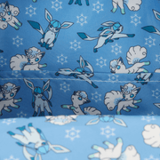 Close-up of the Loungefly Pokémon mini backpack lining with repeating Glaceon, Alolan Vulpix and snowflake pattern.