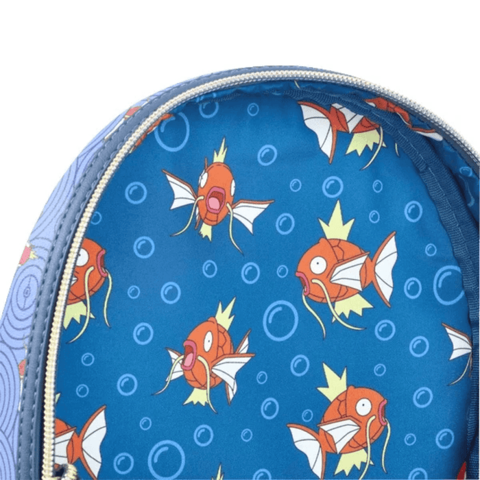 Close up of the Loungefly Pokémon Magikarp mini backpack showing the blue bubble print and Magikarp pattern