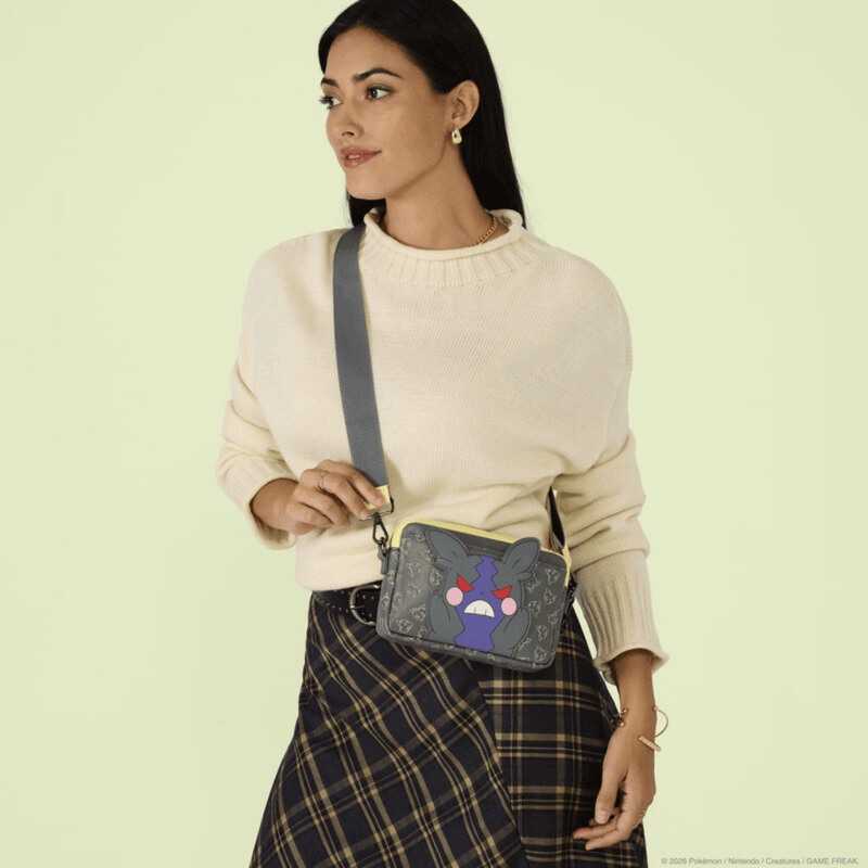 Model wearing the Loungefly Pokémon Morpeko Reversible Crossbody Bag showing grey and purple Hangry Mode Morpeko