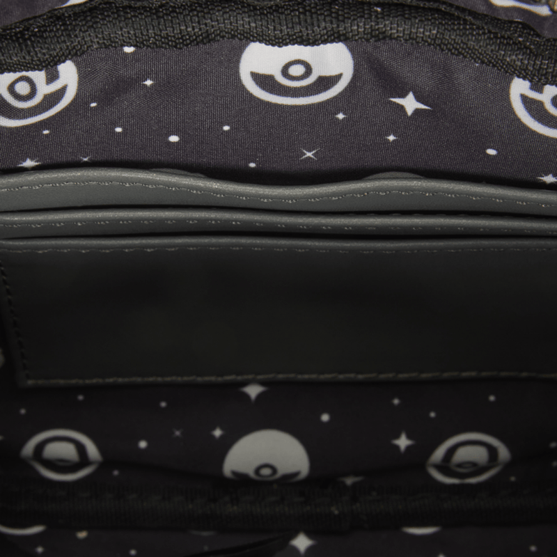 Interior of Loungefly Pokémon Morpeko Crossbody Bag with black Poké Ball and star-print lining and internal slip pocket