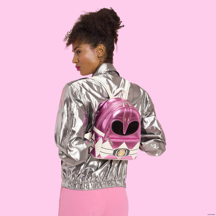 Model wearing Loungefly Power Rangers Pink Ranger mini backpack metallic pink design